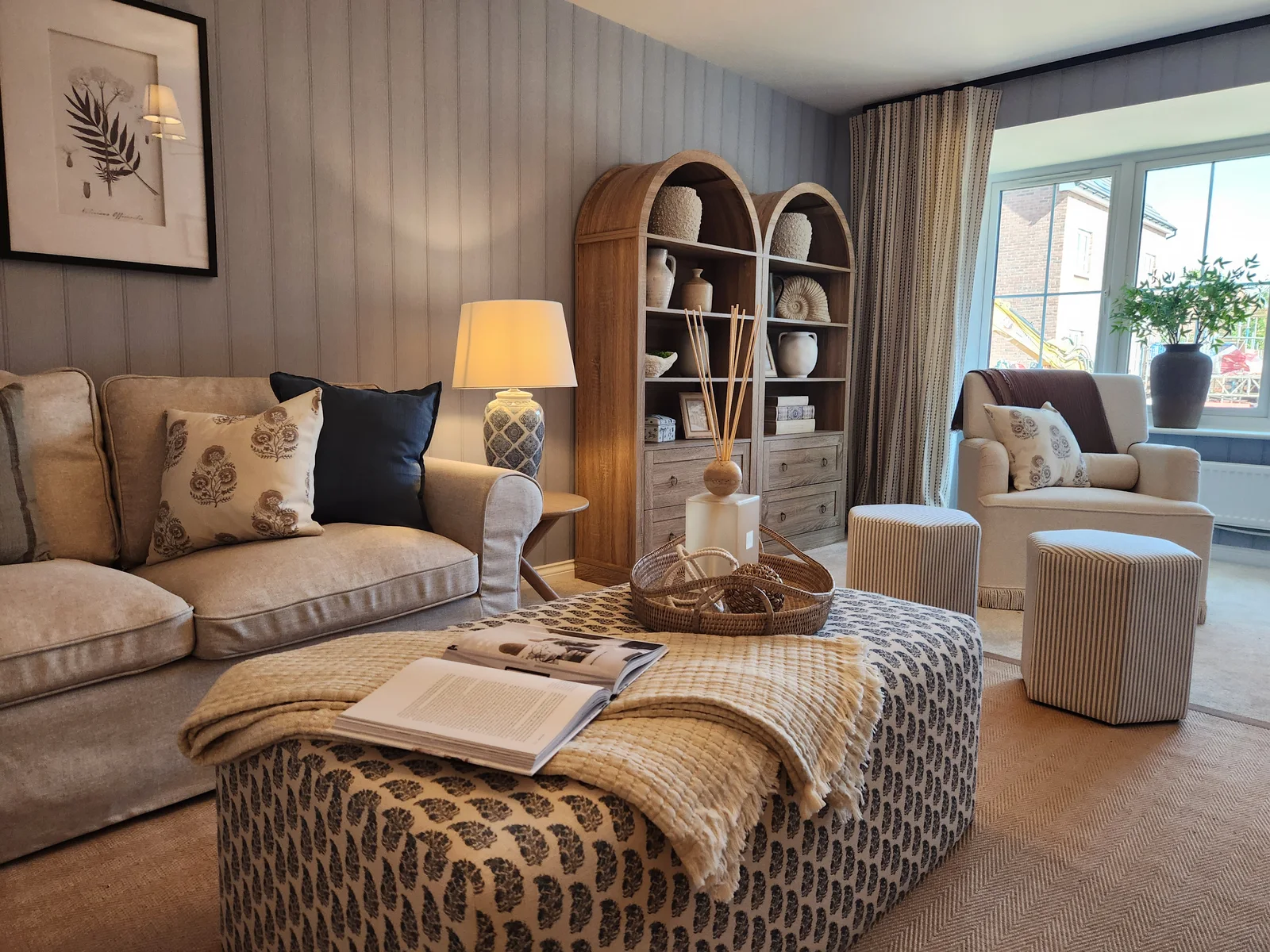 Professionally styled showhome living room with coordinated furniture and accessories