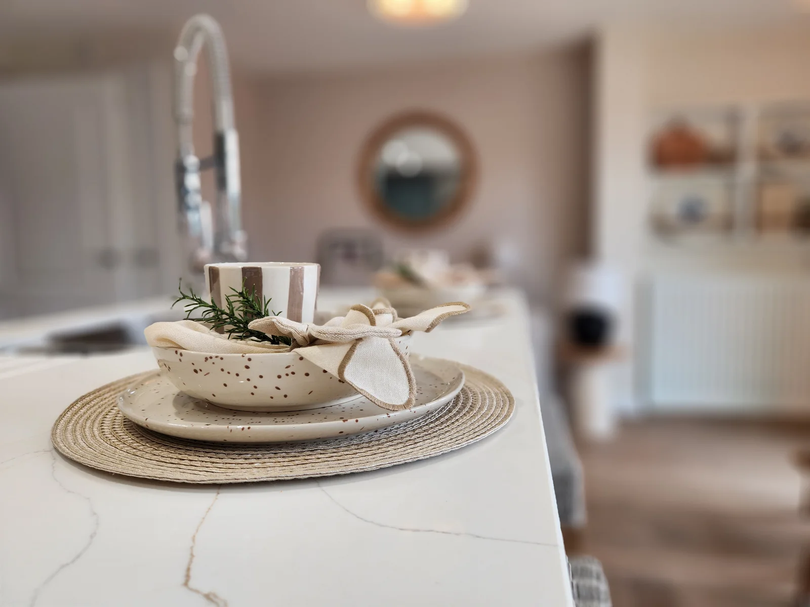 Carefully arranged showhome table setting and kitchen styling